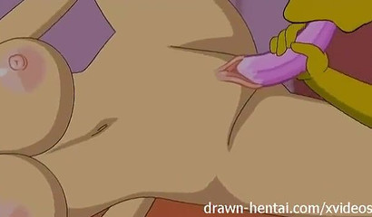 Marge Simpson fucking Lois Griffin's pussy with a strap-on
